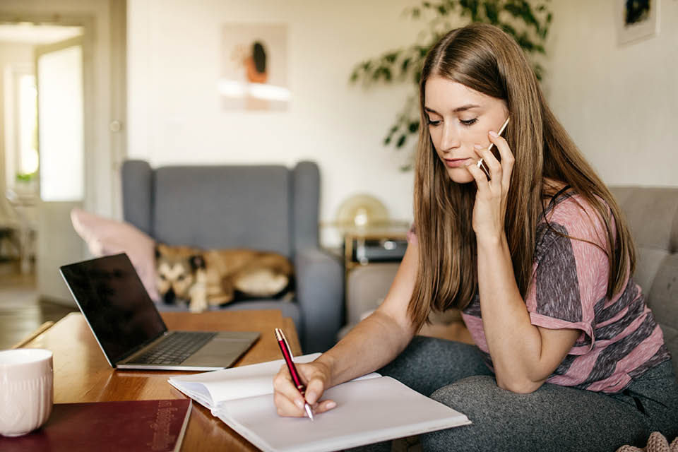 A person taking notes.