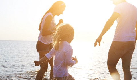 A family enjoying themselves at the beach.