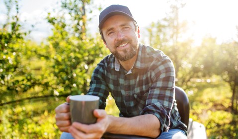 A person with a cup of coffee.