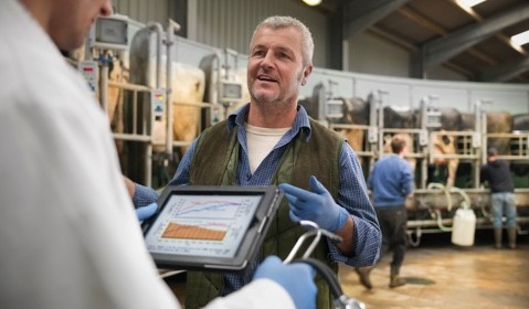 A farmer talking with a technician. 