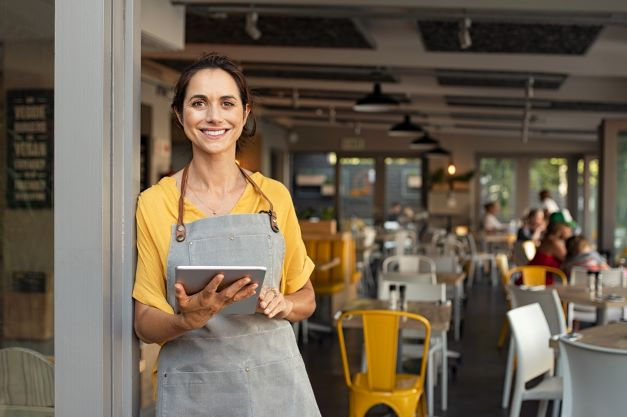 A person holding a tablet.