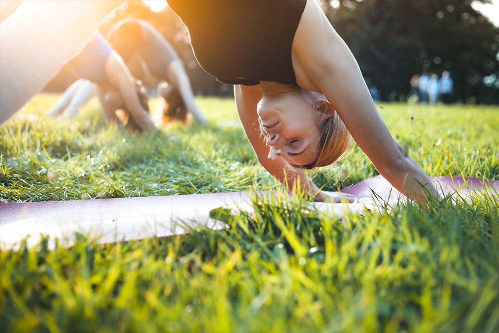 A group of people doing yoga.